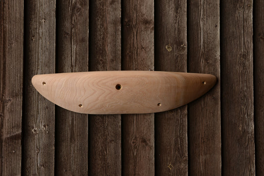 A carved elm edge/sloper. Type of wood: elm. Dimensions(LxWxH): 63x14x10. Eco-friendly holds for modern indoor climbing.