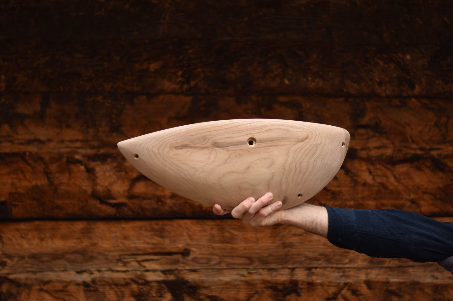 A carved elm sloper. Type of wood: elm. Dimensions(LxWxH): 48.5x18x7.5. Eco-friendly holds for modern indoor climbing.