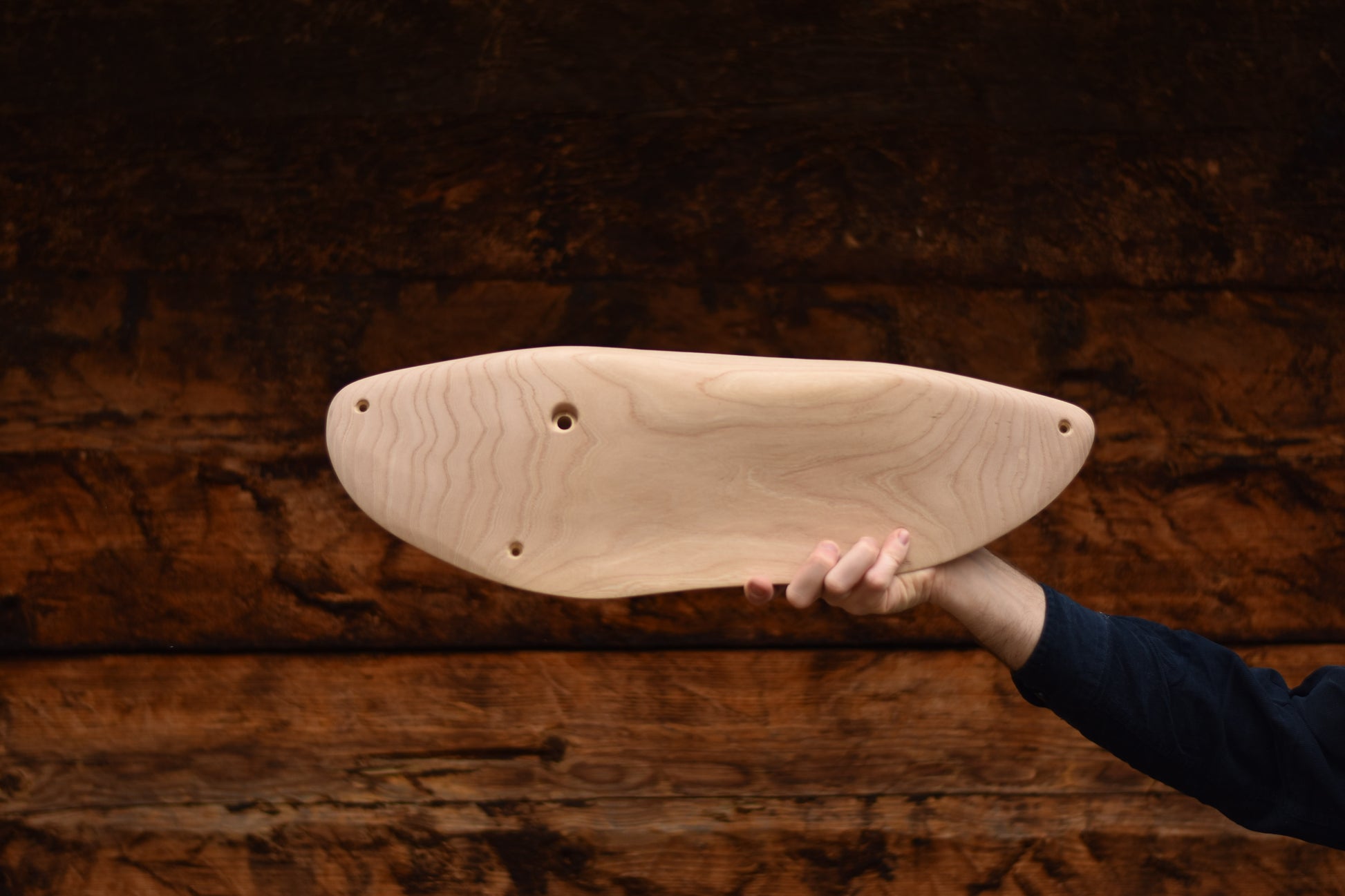 A carved elm sloper. Type of wood: elm. Dimensions(LxWxH): 54x18x5.5. Eco-friendly holds for modern indoor climbing.