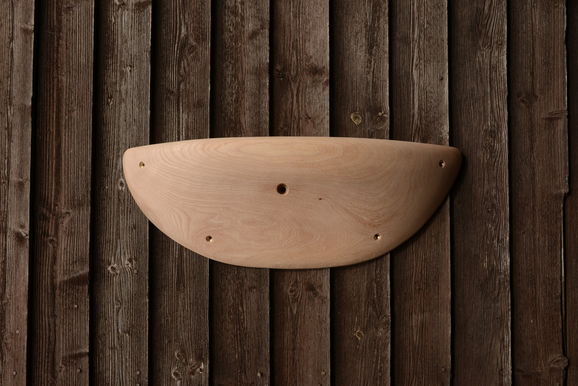 A carved elm sloper. Type of wood: elm. Dimensions(LxWxH): 65x23x11. Eco-friendly holds for modern indoor climbing.