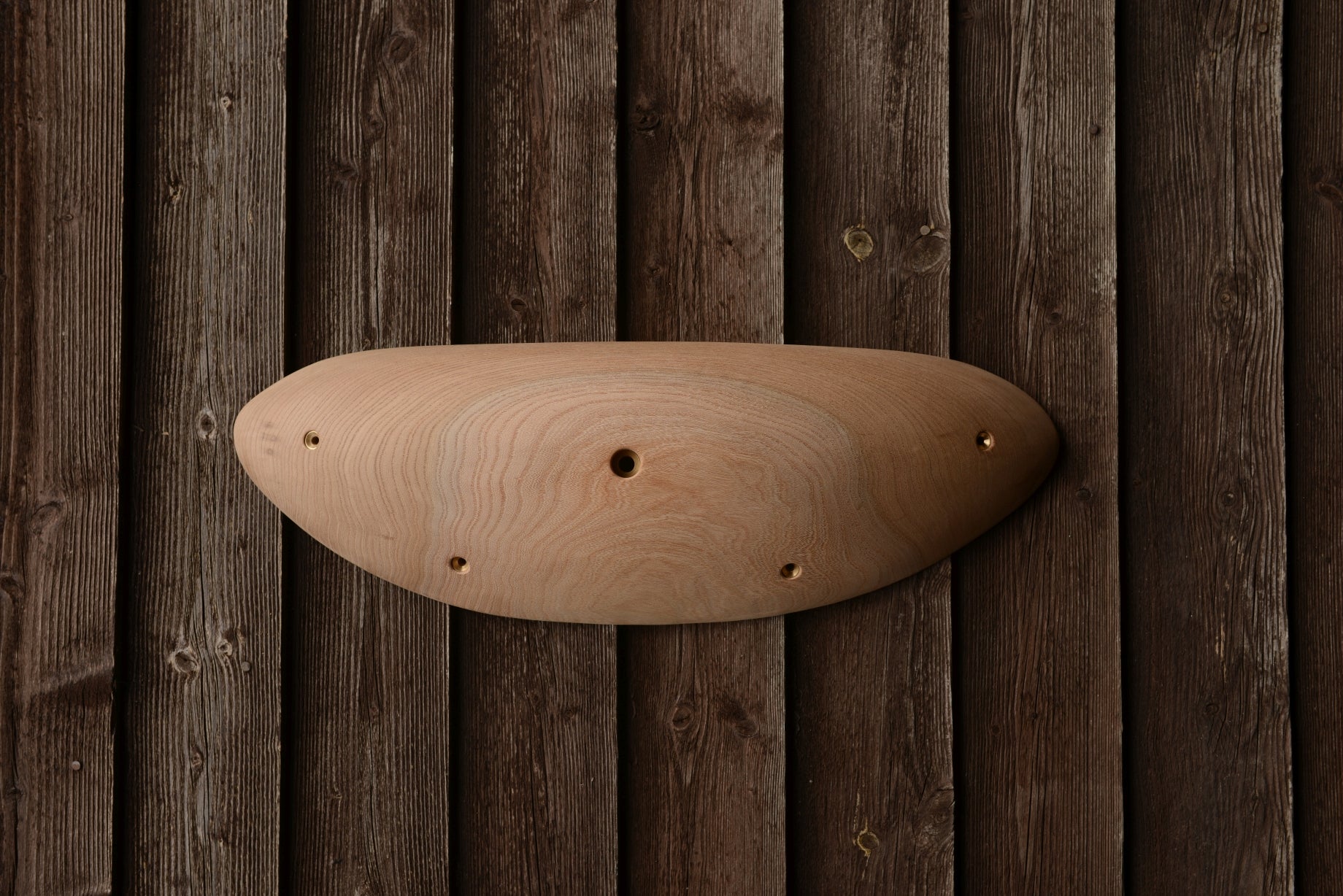 A carved elm sloper. Type of wood: elm. Dimensions(LxWxH): 56x18x10. Eco-friendly holds for modern indoor climbing.