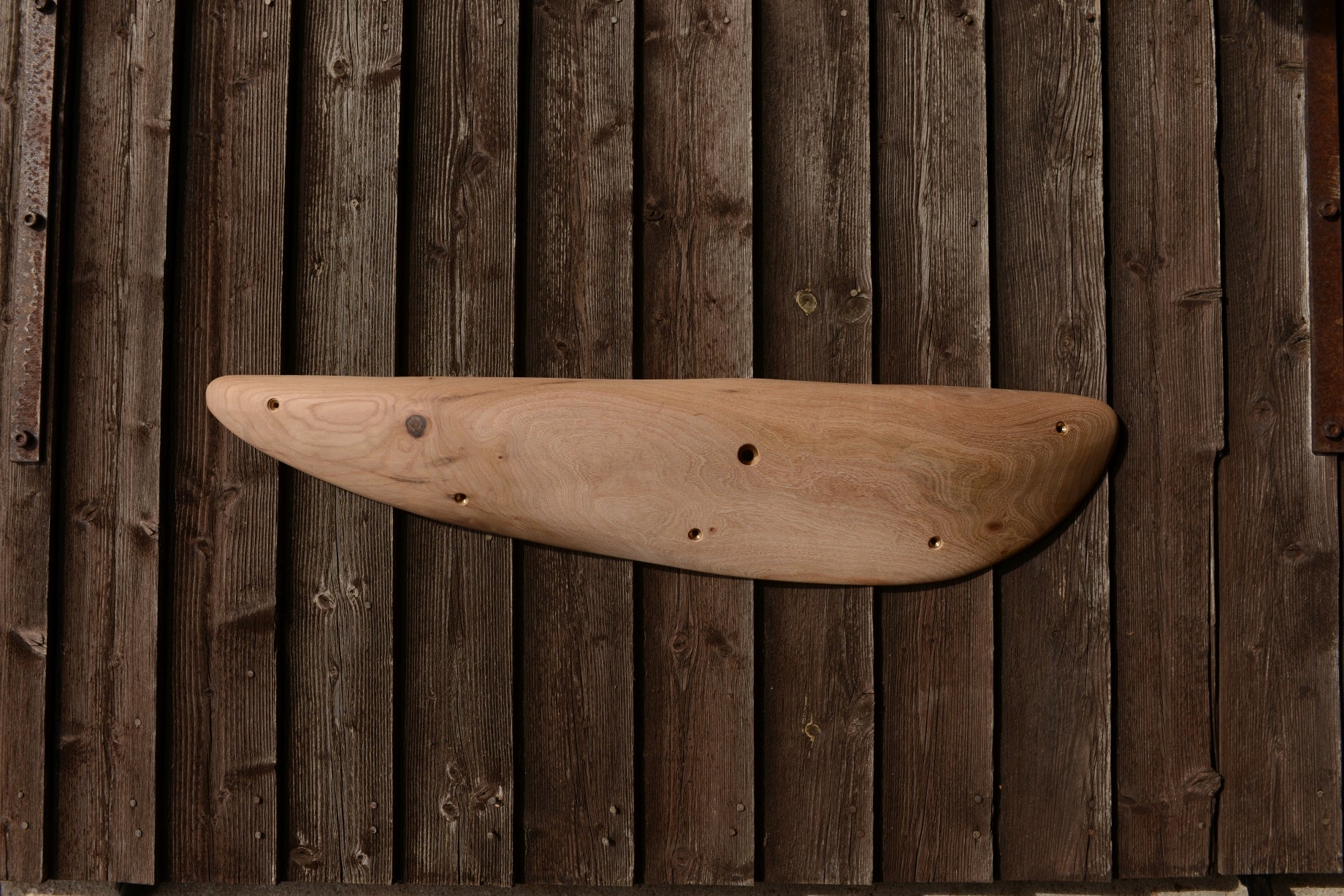 A carved elm sloper. Type of wood: elm. Dimensions(LxWxH): 86x19x7. Eco-friendly holds for modern indoor climbing.