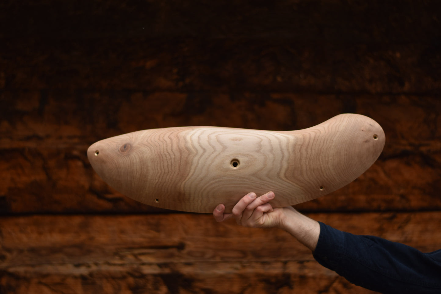 A carved elm sloper. Type of wood: elm. Dimensions(LxWxH): 62x19x8. Eco-friendly holds for modern indoor climbing.